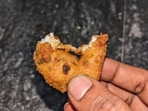 A Bite of a tea time Indian Snacks or Bonda or Vade Stock Photos