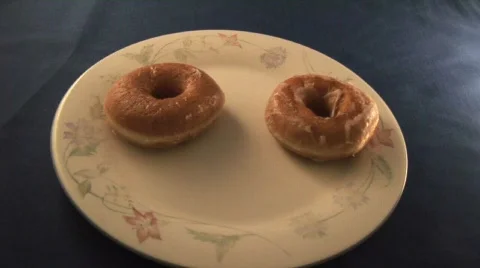 Bites of the doughnut  - Time Lapse Stock Footage 701080
