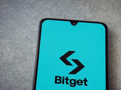 Bitget app launch screen on smartphone on ceramic stone background Stock Photos