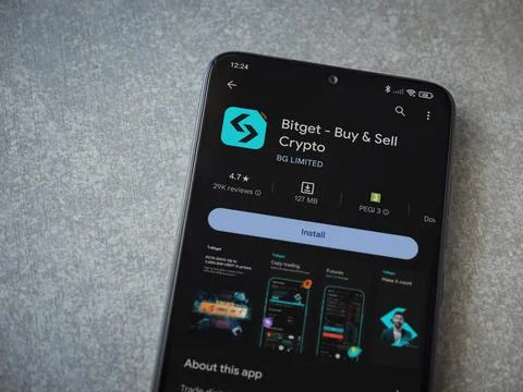 Bitget app play store page on smartphone on ceramic stone background Stock Photos