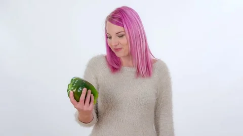 Biting into a big green pepper. Stock Footage 83724826