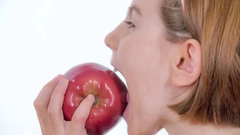 Biting into a big red organic apple Stock Footage 83725091