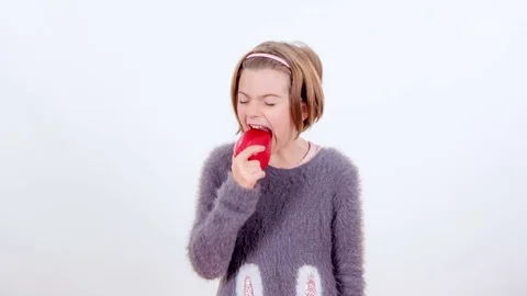 Biting into a big red pepper Video stock 83724352
