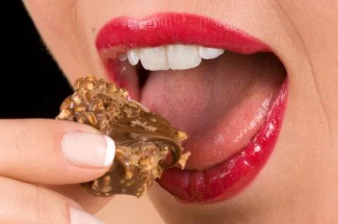 Biting Candy. Fotos de archivo