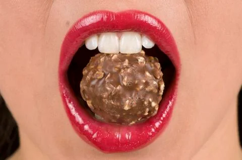 Biting Candy. Fotos de archivo