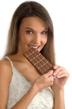 Biting chocolate Stock Photos