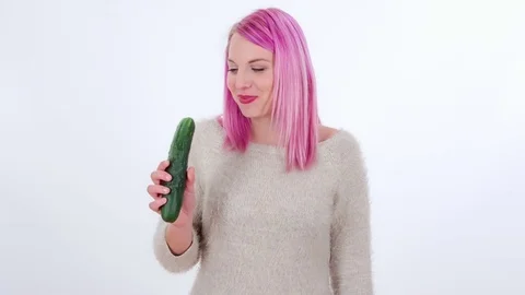 Biting into a cucumber, chewing it and then spitting it out Stock Footage 83724593