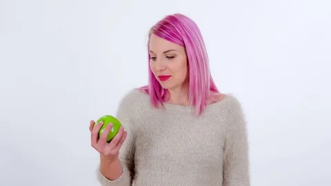 Biting into a delicious green apple Stock Footage 83724450
