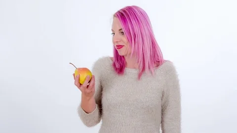 Biting into a delicious yellow apple Stock Footage 83724514