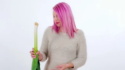 Biting into a leek and chewing it Stock Footage 83724602