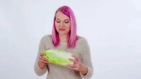 Biting into a radicchio  Stock Footage 83724410