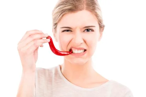 Biting a red chilli pepper Stock Photos