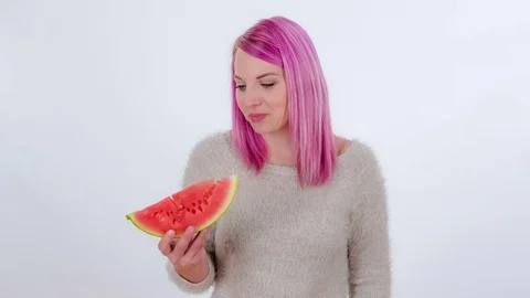 Biting into a slice of watermelon Stock Footage 83724440