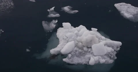 Bits of ice floating around Samarinvagen Bay, Svalbard, Norway (Spitsbergen) Stock Footage 212394339