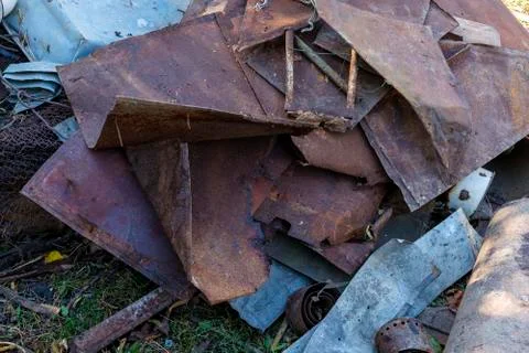 Bits of old rusty scrap metal lying in a heap Stock Photos