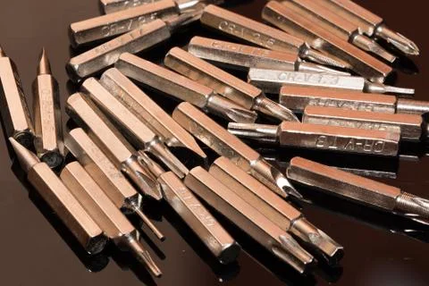 Bits for screwdriver on black background Stock Photos