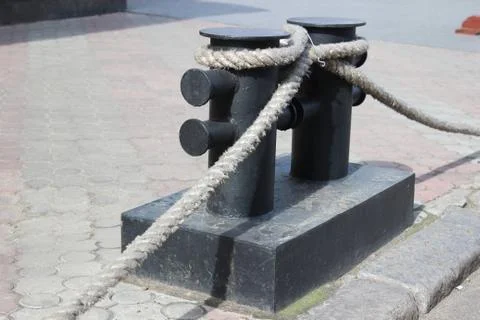 Bitt with rope Stock Photos