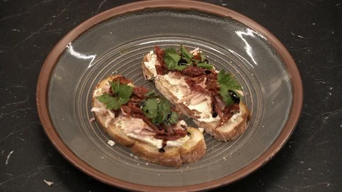 Bitten off bruschetta above view Stock Footage 113528406