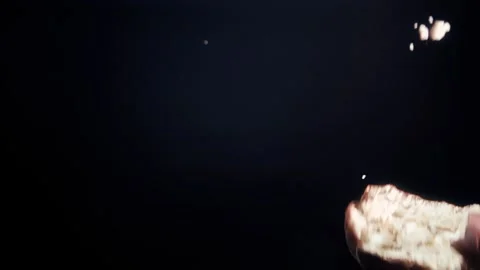 The bitten chocolate chip cookie spins and falls in super slow motion Stock Footage 280685808