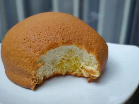 Bitten coffee bread Stock Photos