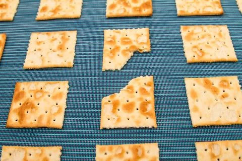 Bitten crackers background Stock Photos
