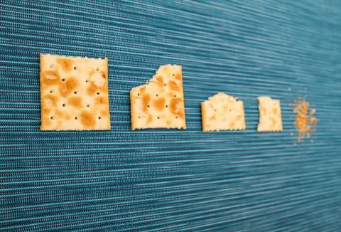 Bitten crackers process Stock Photos