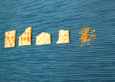 Bitten crackers process Stock Photos