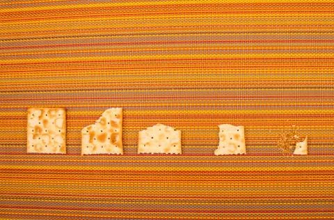 Bitten crackers process Stock Photos