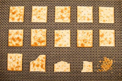 Bitten crackers process Stock Photos
