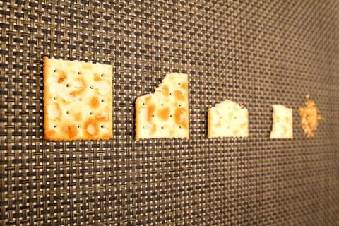 Bitten crackers process Stock Photos