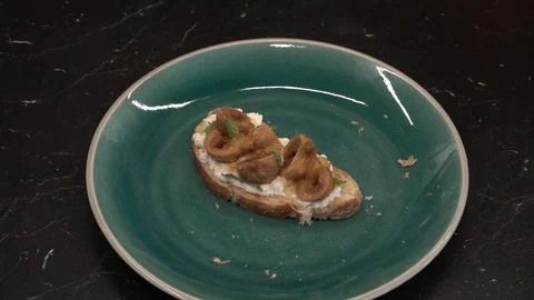 Bitten off fig bruschetta above view Stock Footage 113528548