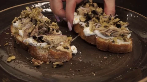Bitten off fish bruschetta Stock Footage 113527722