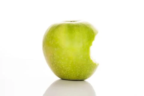 Bitten green apple Stock Photos