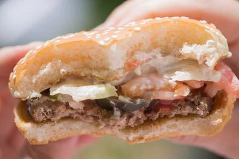 Bitten hamburger closeup Stock Photos