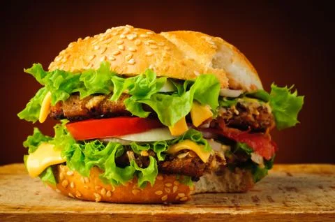 Bitten hamburger Stock Photos