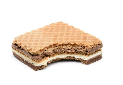 Bitten hazelnut wafer 库存照片