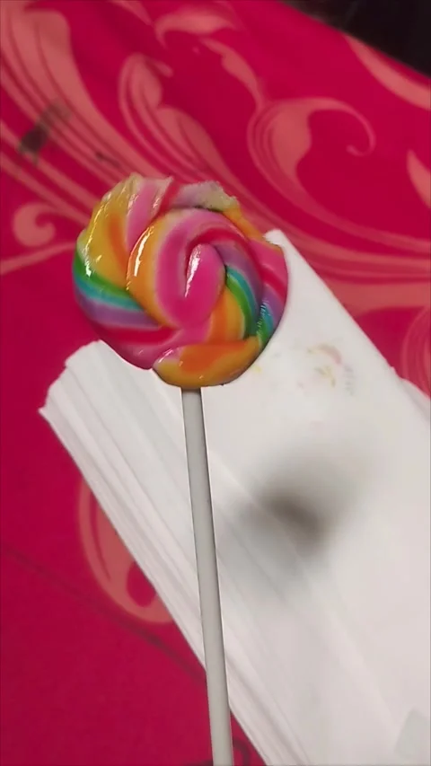 Bitten Lollipop on a Stack of White Tissues Stock Footage 296035793
