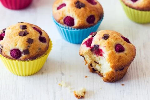 Bitten muffin on white table Stock Photos