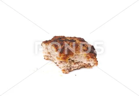 Bitten single small hand made cutlet isolated over white background Stock Photos