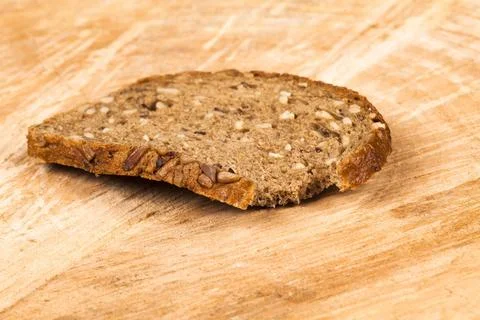 Bitten slice of bread Finnish bread 스톡 사진