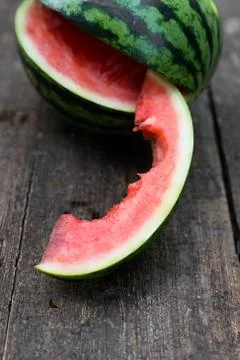 Bitten slice of watermelon 库存照片