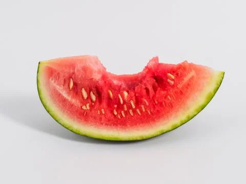 Bitten slice of watermelon on white background. Stock Photos