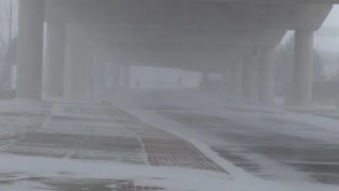 Bitter cold wind and snow under bridge Stock Footage 102296926