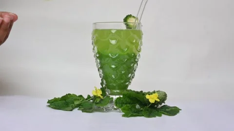 Bitter gourd or bitter melon juice on white background. Видео 330114323