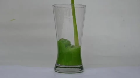 Bitter gourd or bitter melon juice on white background. Stock Footage 330209476
