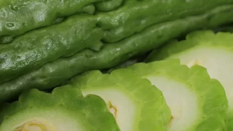 A bitter gourd, a vegetable often used as an ingredient in cuisine, is placed on Stock Footage 275844541