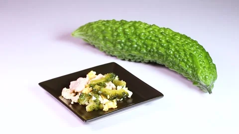 Bitter melon and bitter melon chanpuru (stir-fry), rotating Stock Footage 314972764