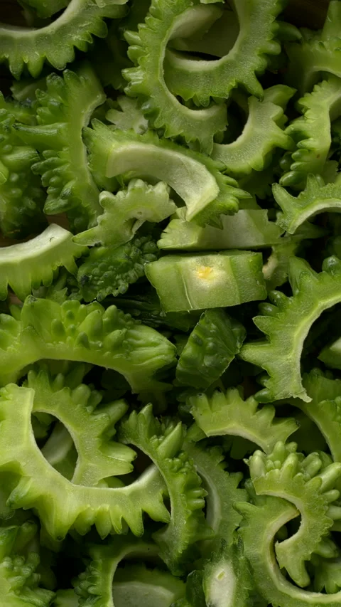 Bitter melon chunks background texture.  Vertical video. Stock Footage 283132733