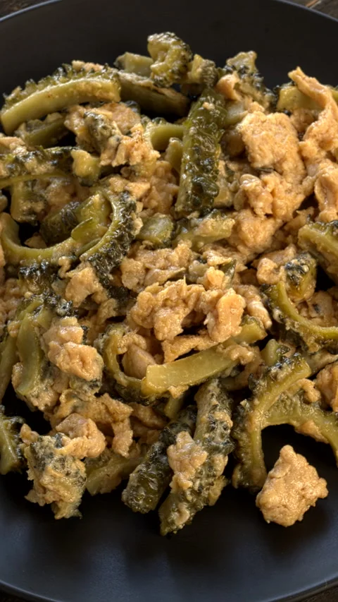 Bitter melon stir-fry with eggs. Vertical video. Stock Footage 283135630