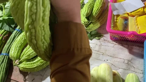 Bitter melon vegetables are sold in traditional markets. organic vegetables.	 Stock Footage 284084893